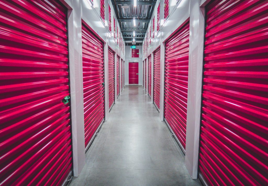 Hallway with doors to storage units.