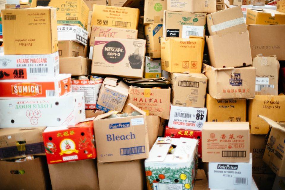 cardborad boxes stacked on top of one another