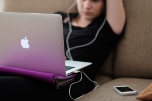 Teen with a laptop.