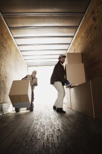 Men loading boxes onto truck