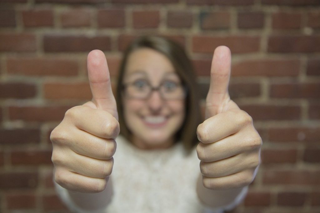 a woman giving two thumbs up to Park Slope movers