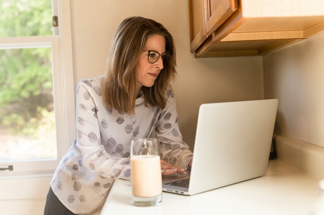 A woman working on a laptop