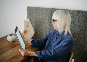 old woman looking into a tablet