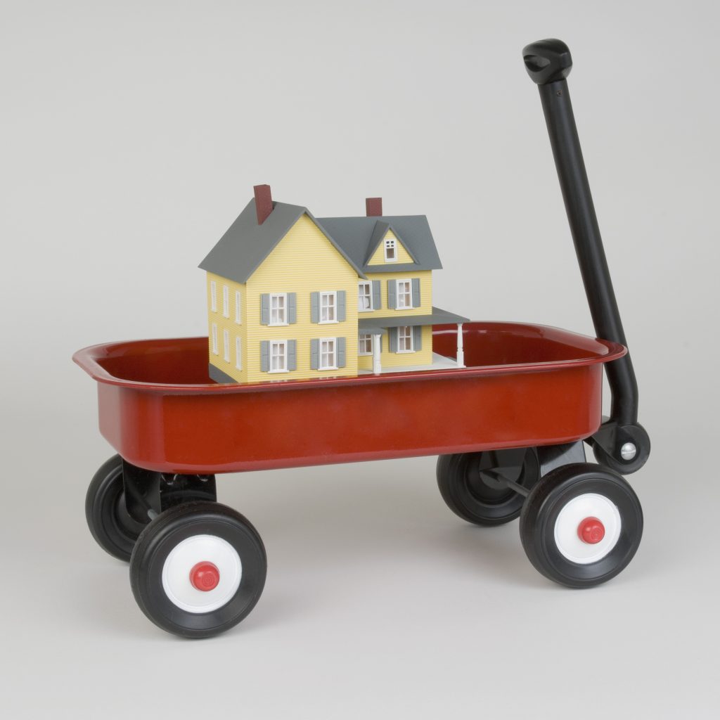 Miniature house in toy wagon