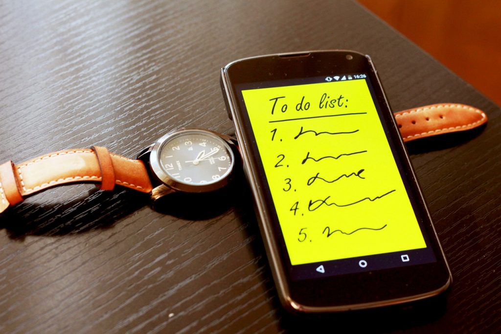 phone and watch that says to-do list